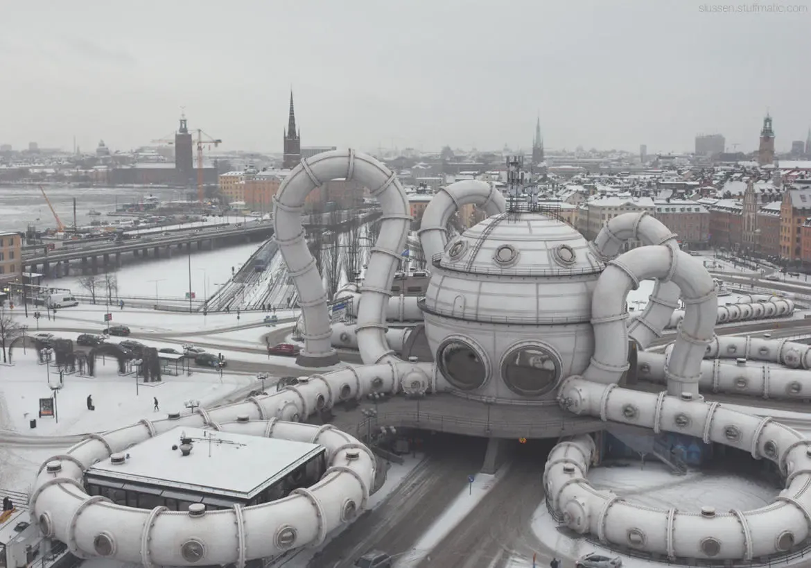 Snöig stadsbild med ett stort, vitt byggnadsverk som liknar en bläckfisk